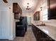 Kitchen with black appliances, granite countertops, and ample cabinet space, connecting to a bright living area at 610 N Pine Ln, Wadesboro, NC 28170