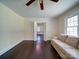 Living room with dark hardwood floors, and a comfortable sofa, creating a welcoming ambiance at 610 N Pine Ln, Wadesboro, NC 28170