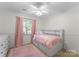 Light-filled bedroom features a built-in headboard and cheerful decor, creating a cozy and inviting atmosphere at 6101 Park Hill Rd, Charlotte, NC 28277