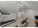 Bright exercise room featuring neutral carpet, exercise equipment, and ceiling fans at 6101 Park Hill Rd, Charlotte, NC 28277
