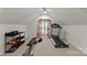 Bright exercise room featuring neutral carpet, exercise equipment, and natural light at 6101 Park Hill Rd, Charlotte, NC 28277