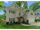 View of the home featuring a covered front entry and a two-car attached garage with a basketball hoop at 6101 Park Hill Rd, Charlotte, NC 28277