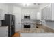 Well-equipped kitchen featuring stainless appliances, white cabinets, and granite countertops at 6101 Park Hill Rd, Charlotte, NC 28277