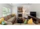 Comfortable living room with fireplace, plush sofa, and a neutral color palette offers a cozy atmosphere at 6101 Park Hill Rd, Charlotte, NC 28277
