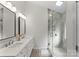 Elegant main bathroom featuring a double sink vanity, large mirrors, and a glass enclosed shower at 6101 Park Hill Rd, Charlotte, NC 28277