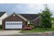 Charming single-story home with brick accents, a two-car garage, and blooming flowers at 625 Court Side Dr, Salisbury, NC 28147