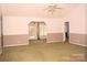 Spacious living room with large windows and a ceiling fan at 625 Court Side Dr, Salisbury, NC 28147