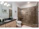 Bathroom featuring granite countertop and large glass enclosed shower at 7912 Baltusrol Ln, Charlotte, NC 28210