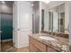 Bright bathroom featuring a granite countertop and light wood cabinets at 7912 Baltusrol Ln, Charlotte, NC 28210