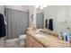 Bathroom with a shower curtain and granite vanity at 7912 Baltusrol Ln, Charlotte, NC 28210