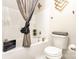 Cozy bathroom featuring tub and shower combination, decorative shower curtain, and stylish vanity decor at 8424 Spirea Ct, Charlotte, NC 28215