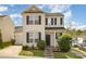 Charming two-story home features manicured lawn, black shutters, and neutral siding on a corner lot at 8424 Spirea Ct, Charlotte, NC 28215