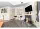 Living room featuring a fireplace, hardwood style flooring, and view to kitchen at 8424 Spirea Ct, Charlotte, NC 28215