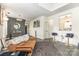 Open concept living area with view to kitchen, modern light fixtures and hardwood style flooring at 8424 Spirea Ct, Charlotte, NC 28215