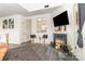 Living room featuring a fireplace, hardwood style flooring, and view to kitchen at 8424 Spirea Ct, Charlotte, NC 28215