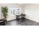 Bright office space with a desk and lots of natural light streaming in from large windows at 8424 Spirea Ct, Charlotte, NC 28215
