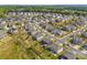 Expansive aerial view of a quiet suburban neighborhood with well-maintained homes and tree-lined streets at 8429 Golden Stone Ln, Fort Mill, SC 29707