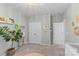 Bright bedroom featuring a neutral color scheme with a plant and large closet at 8429 Golden Stone Ln, Fort Mill, SC 29707