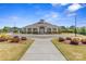 Well-maintained community clubhouse with attractive landscaping and welcoming entrance at 8429 Golden Stone Ln, Fort Mill, SC 29707