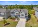 Beautiful two-story home with a well-manicured lawn, two car garage, and attractive landscaping at 8429 Golden Stone Ln, Fort Mill, SC 29707
