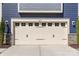 Close-up view of the garage door showcasing carriage-house design and address numbers at 8429 Golden Stone Ln, Fort Mill, SC 29707