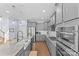 Well-equipped kitchen featuring stainless steel appliances, granite countertops, and sleek gray cabinetry at 8429 Golden Stone Ln, Fort Mill, SC 29707