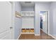 Mudroom with built-in storage, including shelves, hooks, and baskets, perfect for organizing outerwear at 8429 Golden Stone Ln, Fort Mill, SC 29707