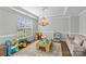 Well-lit playroom with neutral walls and plenty of space for fun and creativity at 8429 Golden Stone Ln, Fort Mill, SC 29707
