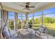 Relaxing sunroom with comfortable seating, natural light, and views of the outdoors at 8429 Golden Stone Ln, Fort Mill, SC 29707