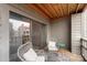 Relaxing balcony space with seating, sliding glass doors, and a view of the outdoors at 9029 J M Keynes Dr # 63, Charlotte, NC 28262