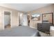 Cozy bedroom with an ensuite bathroom and a view of the community pool on the TV at 9029 J M Keynes Dr # 63, Charlotte, NC 28262