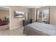 Bedroom featuring a dresser with a mirror and a community pool view on the television at 9029 J M Keynes Dr # 63, Charlotte, NC 28262