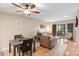Inviting living room with comfortable seating and a sliding glass door leading to a balcony at 9029 J M Keynes Dr # 63, Charlotte, NC 28262