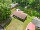 Aerial view of a home with a well-maintained lawn, a large backyard, and mature trees at 907 E 9Th Ave, Gastonia, NC 28054