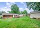 Large backyard with a deck, shed, and expansive green space, perfect for outdoor activities at 907 E 9Th Ave, Gastonia, NC 28054