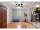 Bonus Room featuring wood floors, a ceiling fan and additional storage areas at 907 E 9Th Ave, Gastonia, NC 28054