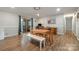 Spacious dining room with wood floors, neutral paint, and sliding door access to the outdoors at 907 E 9Th Ave, Gastonia, NC 28054