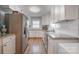 Updated kitchen featuring white cabinets, granite countertops and stainless steel appliances at 907 E 9Th Ave, Gastonia, NC 28054