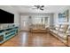 Bright and airy living room featuring hardwood floors and a large window at 907 E 9Th Ave, Gastonia, NC 28054