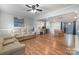 An open-concept living space with hardwood floors and neutral walls at 907 E 9Th Ave, Gastonia, NC 28054