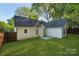Spacious backyard featuring lawn area, fenced perimeter and an inviting patio at 9200 Forest Green Dr, Charlotte, NC 28227