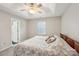 Neutral bedroom features ceiling fan, window, and entry to ensuite bathroom at 9200 Forest Green Dr, Charlotte, NC 28227