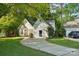 Exterior view of home, landscaping, driveway and detached garage at 9200 Forest Green Dr, Charlotte, NC 28227