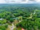 Picturesque aerial view shows house surrounded by mature trees, highlighting the private and lush setting at 1009 Rainbow Cir, Catawba, SC 29704