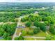 Beautiful aerial shot of a home nestled within green landscape, showcasing a serene, spacious property at 1009 Rainbow Cir, Catawba, SC 29704