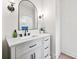 Elegant bathroom featuring a bright white vanity, sleek black hardware, and modern light fixtures at 1009 Rainbow Cir, Catawba, SC 29704