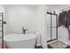 Stylish bathroom features a modern soaking tub and a separate glass-enclosed shower at 1009 Rainbow Cir, Catawba, SC 29704