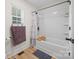 Bright bathroom with a shower and tub combination, complete with white subway tile and modern fixtures at 1009 Rainbow Cir, Catawba, SC 29704