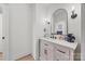 Charming bathroom featuring a modern vanity, elegant black hardware, and a stylish, arched mirror at 1009 Rainbow Cir, Catawba, SC 29704