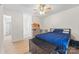 Comfortable bedroom featuring a ceiling fan, wood-look floors, and a bed with a blue comforter at 1009 Rainbow Cir, Catawba, SC 29704